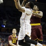  Texas guard Martez Walker (24) goes up for a shot against Arizona State guard Shaquielle McKissic (40) during the second half of a second-round game in the NCAA college basketball tournament Thursday, March 20, 2014, in Milwaukee. (AP Photo/Morry Gash)