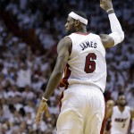 Miami Heat's LeBron James (6) gestures after shooting a three-point basket during the second half in Game 1 of an opening-round NBA basketball playoff series against the Charlotte Bobcats, Sunday, April 20, 2014, in Miami. The Heat defeated the Bobcats 99-88. (AP Photo/Lynne Sladky)