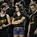 Arizona State fans react to a UCLA touchdown during the second half of an NCAA college football game, Thursday, Sept. 25, 2014, in Tempe, Ariz. (AP Photo/Matt York)