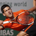 Serbia's Novak Djokovic clenches his fist after scoring a point in the men's final of the French Open tennis tournament against Switzerland's Stan Wawrinka at the Roland Garros stadium, in Paris, France, Sunday, June 7, 2015. (AP Photo/Michel Euler)

