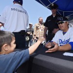  Los Angeles Dodgers starting pitcher Ryu Hyun-Jin, of South Korea, signs autographs prior to their baseball game agains the Arizona Diamondbacks, Sunday, April 20, 2014, in Los Angeles, for monetary donations that will benefit the survivors and families of those who lost their lives aboard the South Korean ferry Sewol, which capsized on April 16. (AP Photo/Mark J. Terrill)