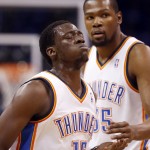 Oklahoma City Thunder forward Kevin Durant (35) checks on teammate Reggie Jackson (15) after Jackson fell in the first quarter of Game 4 of the Western Conference finals NBA basketball playoff series against the San Antonio Spurs in Oklahoma City, Tuesday, May 27, 2014. (AP Photo/Sue Ogrocki)