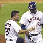  Houston Astros' Chris Carter (23) is congratulated by Jose Altuve (27) after hitting a solo home run against the Arizona Diamondbacks in the fourth inning of a baseball game Wednesday, June 11, 2014, in Houston. (AP Photo/Pat Sullivan)