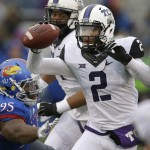TCU quarterback Trevone Boykin (2) runs past Kansas defensive lineman Andrew Bolton (95) during the first half of an NCAA college football game in Lawrence, Kan., Saturday, Nov. 15, 2014. (AP Photo/Orlin Wagner)