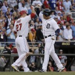 Miguel Cabrera, of the Detroit Tigers, celebrates with Mike Trout, of the Los Angeles Angels, after hitting a home run during the first inning of the MLB All-Star baseball game, Tuesday, July 15, 2014, in Minneapolis. (AP Photo/Jeff Roberson)