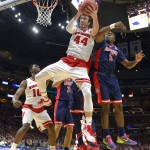 Wisconsin's Frank Kaminsky (44) grabs a rebound in front of Arizona's Stanley Johnson (5) during the first half of a college basketball regional final in the NCAA Tournament, Saturday, March 28, 2015, in Los Angeles. (AP Photo/Mark J. Terrill)