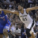 San Antonio Spurs' Tim Duncan (21) tries to steal the ball from Los Angeles Clippers' DeAndre Jordan (6) during the first half of Game 6 in an NBA basketball first-round playoff series, Thursday, April 30, 2015, in San Antonio. (AP Photo/Darren Abate)