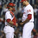 Philadelphia Phillies relief pitcher Elvis Araujo, right, confers with catcher Carlos Ruiz in the seventh inning of a baseball game against the Arizona Diamondbacks, Friday, May 15, 2015, in Philadelphia. Araujo retired the only batter he faced, and picked up the win in the Phillies' 4-3 victory. (AP Photo/Laurence Kesterson)