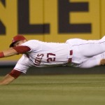 Los Angeles Angels' Mike Trout dives but is unable to connect on a catch during a baseball game against the Arizona Diamondbacks at Angel Stadium, Monday, June 15, 2015 in Anaheim, Calif. (Matt Masin/The Orange County Register via AP)