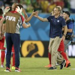 United States' head coach Juergen Klinsmann, right, celebrates with his players after the group G World Cup soccer match between Ghana and the United States at the Arena das Dunas in Natal, Brazil, Monday, June 16, 2014. United States won the match 2-1. (AP Photo/Dolores Ochoa)