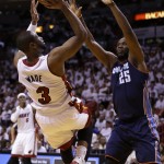  Miami Heat's Dwyane Wade (3) shoots over Charlotte Bobcats' Al Jefferson (25) during the first half in Game 1 of an opening-round NBA basketball playoff series, Sunday, April 20, 2014, in Miami. (AP Photo/Lynne Sladky)