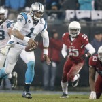 Carolina Panthers' Cam Newton (1) runs for a long gain against the Arizona Cardinals in the second half of an NFL wild card playoff football game in Charlotte, N.C., Saturday, Jan. 3, 2015. (AP Photo/Bob Leverone)