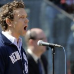 Canadian singer Paul Nolan sings God Bless America between the top and bottom of the seventh innings during an opening day baseball game between the New York Yankees and the Toronto Blue Jays in New York, Monday, April 6, 2015. (AP Photo/Kathy Willens)