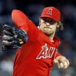 Los Angeles Angels' C.J. Wilson throws a pitch against against the Arizona Diamondbacks during the first inning of a baseball game Thursday, June 18, 2015, in Phoenix. (AP Photo/Ross D. Franklin)