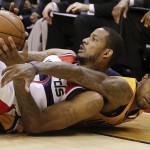  Washington Wizards forward Trevor Ariza, left, and Indiana Pacers forward Paul George (24) vie for control of the ball during the second half in Game 6 of an Eastern Conference semifinal NBA basketball playoff series in Washington, Thursday, May 15, 2014. (AP Photo/Alex Brandon)