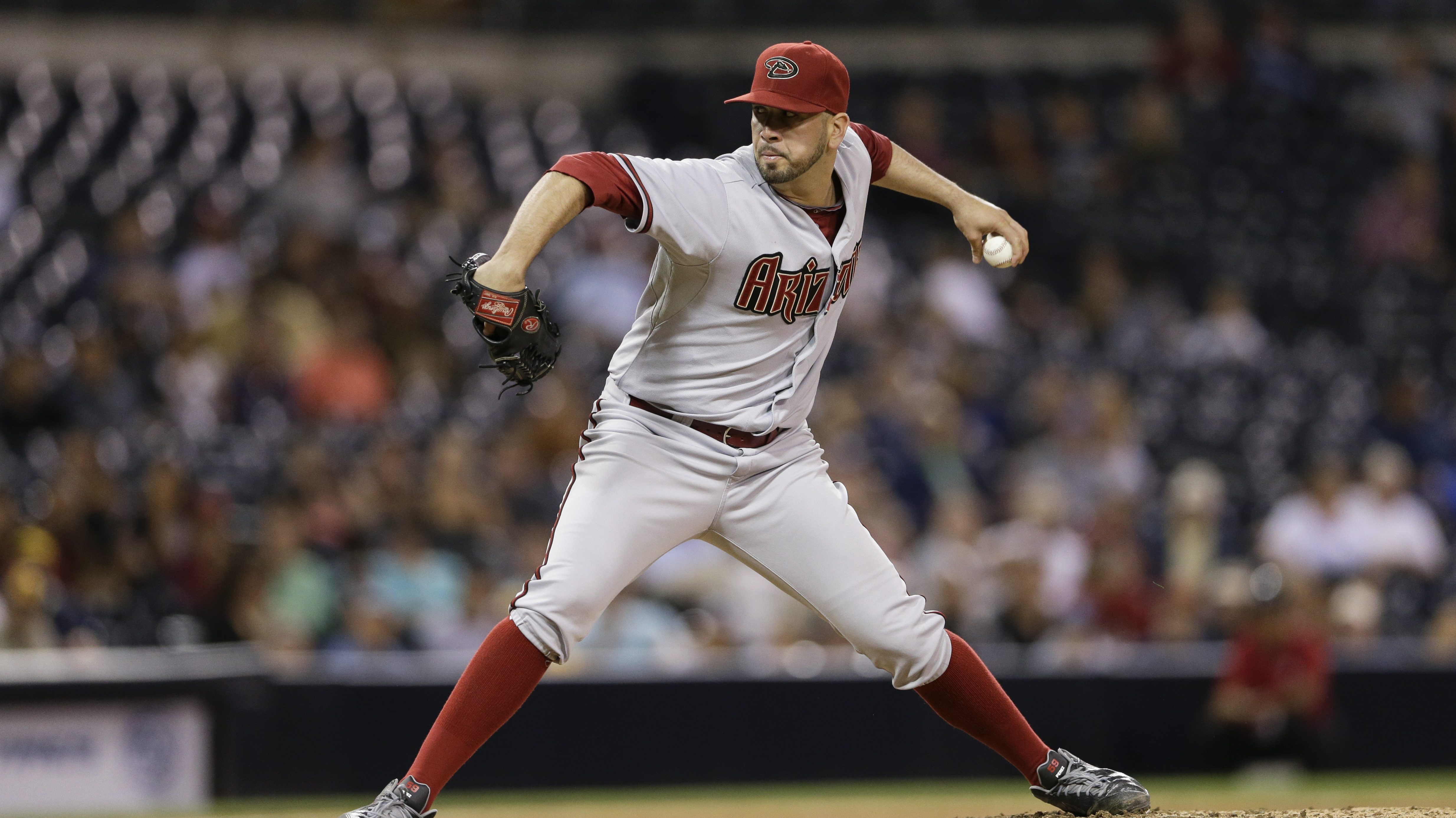 Arizona Diamondbacks reliever Oliver Perez pitches to a San Diego Padres batter during the eighth i...