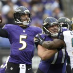 Baltimore Ravens quarterback Joe Flacco (5) passes the ball during the first half of an NFL football game against the Jacksonville Jaguars in Baltimore, Sunday, Dec. 14, 2014. (AP Photo/Nick Wass)
