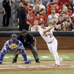 National League's Jhonny Peralta, of the St. Louis Cardinals, hits an RBI single during the second inning of the MLB All-Star baseball game, Tuesday, July 14, 2015, in Cincinnati. (AP Photo/Michael E. Keating )
