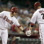 Arizona Diamondbacks' Aaron Hill (2) celebrates his home run against the Detroit Tigers with teammate Miguel Montero, left, during the first inning of a baseball game on Tuesday, July 22, 2014, in Phoenix. (AP Photo)