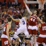 Wisconsin's Frank Kaminsky tries to block a shot by Duke's Grayson Allen (3) during the first half of the NCAA Final Four college basketball tournament championship game Monday, April 6, 2015, in Indianapolis. (AP Photo/David J. Phillip)