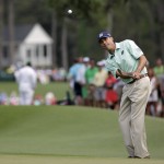  Matt Kuchar hits an approach shot to the eighth green during the fourth round of the Masters golf tournament Sunday, April 13, 2014, in Augusta, Ga. (AP Photo/David J. Phillip)