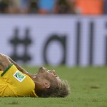 Brazil's Neymar reacts after taking a knock during the World Cup quarterfinal soccer match between Brazil and Colombia at the Arena Castelao in Fortaleza, Brazil, Friday, July 4, 2014. (AP Photo/Manu Fernandez)