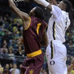 Arizona State's Scott Roosevelt (1) shoots against Oregon's Jordan Bell (1) during the first half of an NCAA college basketball game in Corvallis, Ore., Saturday, Jan. 10, 2015. (AP Photo/Greg Wahl-Stephens)