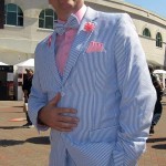 Jack Gill of LaGrange, Ky., wears his blue three-piece seersucker suit at Churchill Downs before the 141st running of the Kentucky Oaks horse race at Churchill Downs Friday, May 1, 2015, in Louisville, Ky. (AP Photo/Gary Graves)