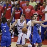  Los Angeles Clippers' Blake Griffin, center, drives to the basket as he is defended by Oklahoma City Thunder's Serge Ibaka, left, of Congo, and Steven Adams during the first half in Game 6 of the NBA Western Conference semi-finals on Thursday, May 15, 2014, in Los Angeles. (AP Photo/Jae C. Hong)