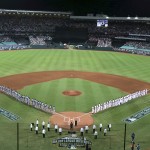 The teams line up for the national anthems before the Major League Baseball opening game between the Los Angeles Dodgers and Arizona Diamondbacks at the Sydney Cricket Ground in Sydney, Australia Saturday, March 22, 2014. (AP Photo/Rick Rycroft)