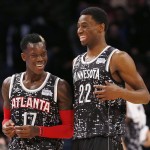 World Team's Dennis Schroder, left, of the Atlanta Hawks, and Andrew Wiggins, of the Minnesota Timberwolves, talk during the second half against the U.S. Team in NBA basketball's Rising Stars Challenge, Friday, Feb. 13, 2015, in New York. (AP Photo/Julio Cortez)