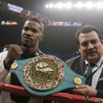 Actor Jamie Foxx, left, poses with the champion's belt after singing the national anthem before the start of the world welterweight championship bout between Floyd Mayweather Jr., and Manny Pacquiao, on Saturday, May 2, 2015 in Las Vegas.(AP Photo/Isaac Brekken)