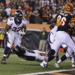 Denver Broncos running back C.J. Anderson (22) runs 1 yard for a touchdown during the second half of an NFL football game against the Cincinnati Bengals on Monday, Dec. 22, 2014, in Cincinnati. (AP Photo/Michael Conroy)