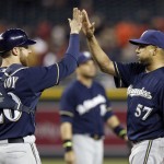  Milwaukee Brewers' Jonathan Lucroy, left, and pitcher Francisco Rodriguez (57) celebrate after the final out in the ninth inning of a baseball game against the Arizona Diamondbacks on Tuesday, June 17, 2014, in Phoenix. The Brewers defeated the Diamondbacks 7-5. (AP Photo/Ross D. Franklin)