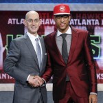 Kelly Oubre Jr., right, poses for photos with NBA Commissioner Adam Silver after being selected 15th overall by the Atlanta Hawks during the NBA basketball draft, Thursday, June 25, 2015, in New York. (AP Photo/Kathy Willens)
