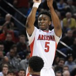 Arizona forward Stanley Johnson shoots over Texas Southern guard Deverell Biggs during the second half of an NCAA college basketball second round game in Portland, Ore., Thursday, March 19, 2015. Johnson scored 22 points as Arizona won 93-72. (AP Photo/Greg Wahl-Stephens)