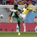Ivory Coast's Wilfried Bony (12) and Colombia's Abel Aguilar (8) battle for the ball during the group C World Cup soccer match between Colombia and Ivory Coast at the Estadio Nacional in Brasilia, Brazil, Thursday, June 19, 2014. (AP Photo/Marcio Jose Sanchez)