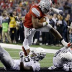Ohio State's Ezekiel Elliott runs for a nine-yard touchdown during the second half of the NCAA college football playoff championship game against Oregon Monday, Jan. 12, 2015, in Arlington, Texas. (AP Photo/David J. Phillip)