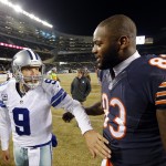Dallas Cowboys quarterback Tony Romo (9) talks to Chicago Bears tight end Martellus Bennett (83) after an NFL football game Thursday, Dec. 4, 2014, in Chicago. The Dallas Cowboys won 41-28. (AP Photo/Charles Rex Arbogast)