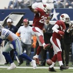 After making an interception against the Dallas Cowboys, Arizona Cardinals free safety Tyrann Mathieu (32) celebrates with free safety Rashad Johnson (26) during the second half of an NFL football game Sunday, Nov. 2, 2014, in Arlington, Texas. (AP Photo/Brandon Wade)