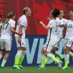 United States' Tobin Heath, fAbby Wambach, Lauren Holiday, Christie Rampone and Carli Lloyd, fromleft, celebrate Wambach's goal against Nigeria during the first half of a FIFA Women's World Cup soccer game Tuesday, June 16, 2105, in Vancouver, British Columbia, Canada. (Darryl Dyck/The Canadian Press via AP)
