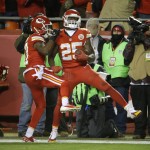 Kansas City Chiefs running back Jamaal Charles (25) celebrates his touchdown with wide receiver Donnie Avery (17) in the second half of an NFL football game against the Denver Broncos in Kansas City, Mo., Sunday, Nov. 30, 2014. (AP Photo/Charlie Riedel)