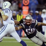 New England Patriots defensive end Rob Ninkovich (50) tries to tackle Indianapolis Colts quarterback Andrew Luck (12) during the first half of the NFL football AFC Championship game Sunday, Jan. 18, 2015, in Foxborough, Mass. (AP Photo/Charles Krupa)