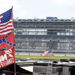 Confederate and American flags fly on top of motor homes at Daytona International Speedway, Saturday, July 4, 2015, in Daytona Beach, Fla. NASCAR and the speedway offered to replace any flag a race brings to the track with an American flag. (AP Photo/Phelan M. Ebenhack)
