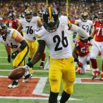 Steelers running back Le'Veon Bell (26) celebrates in the endzone after scoring a touchdown in the final minute of the first half of the NFL football game on Sunday, Dec. 14, 2014, in Atlanta. (AP Photo/Atlanta Journal-Constitution, Curtis Compton)