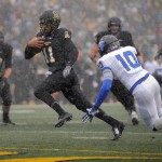 Appalachian State quarterback Taylor Lamb (11) scores a touchdown against Georgia State during an NCAA college football game in Boone, N.C., Saturday, Nov. 1, 2014. (AP Photo/The Winston-Salem Journal, Bruce Chapman)