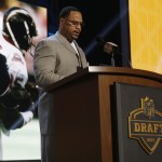 Former NFL player Anthony Miller announces the San Diego Chargers selects Miami linebacker Denzel Perryman as the 48th pick in the second round of the 2015 NFL Football Draft, Friday, May 1, 2015, in Chicago. (AP Photo/Charles Rex Arbogast)