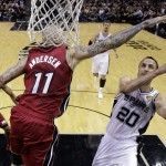San Antonio Spurs guard Manu Ginobili (20) shoots as Miami Heat forward Chris Andersen (11) defends during the first half in Game 1 of the NBA basketball finals on Thursday, June 5, 2014, in San Antonio. (AP Photo/Eric Gay)