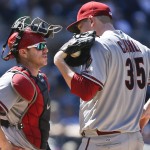 Arizona Diamondbacks starting pitcher Trevor Cahill and catcher Miguel Montero have meeting during a bases loaded jam against the San Diego Padres in the fourth inning of a baseball game Monday, Sept. 1, 2014, in San Diego. (AP Photo/Lenny Ignelzi)
