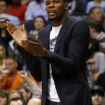 Oklahoma City Thunder forward Kevin Durant cheers on his teammates from the bench during the first half of an NBA basketball game against the Phoenix Suns, Thursday, Feb. 26, 2015, in Phoenix. (AP Photo/Matt York)
